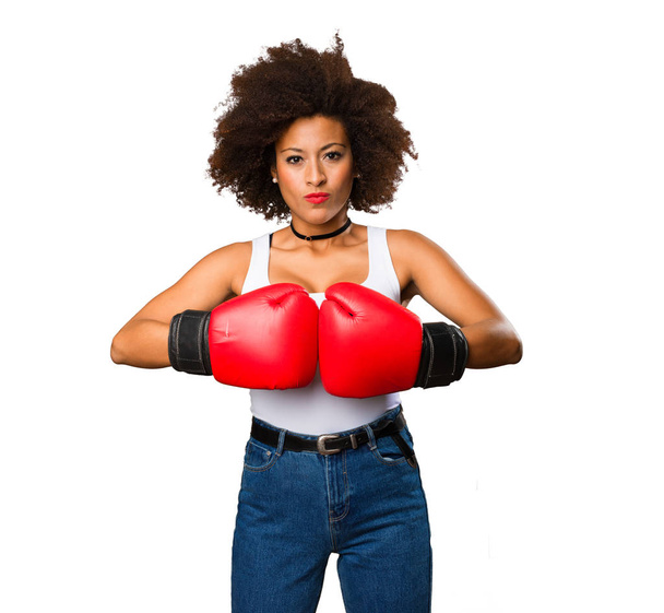 young black woman using boxing gloves isolated on white background - Photo, Image
