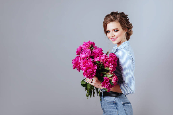 Fashion beautiful model with flowers , spring look. - Фото, зображення