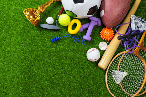 Various sport objects on green grass - Foto, Imagen