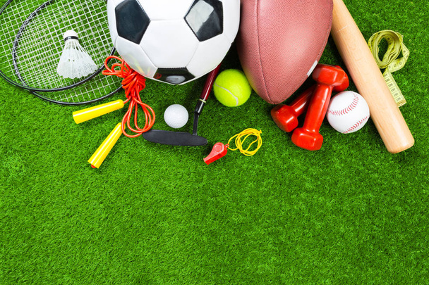 Various sport objects on green grass - Foto, Imagen