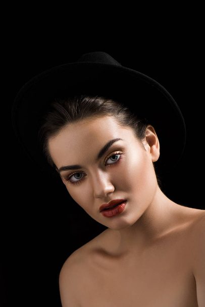 beautiful fashionable girl posing in trendy felt hat, isolated on black - Zdjęcie, obraz