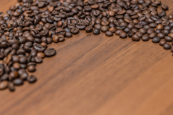 Beautiful coffee beans with wooden table, free space - Foto, Bild