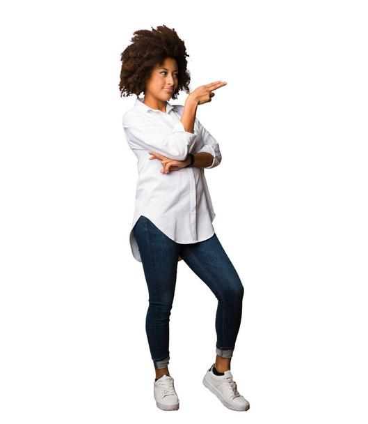 young black woman pointing space full body - Fotó, kép