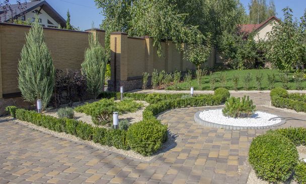Cobbled concrete paving slab track in a beautifully manicured garden top wiew - Photo, Image