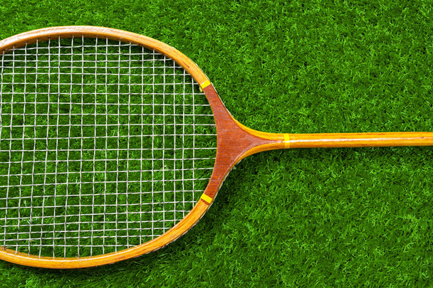 Wooden badminton racket on green grass - Valokuva, kuva