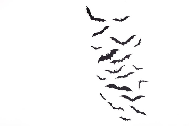Halloween and decoration Empty space for design copy pace - black paper bats flying over white background - Photo, Image