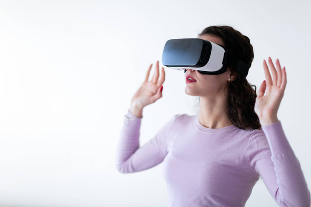 Young excited woman trying virtual reality headset experience - Fotografie, Obrázek
