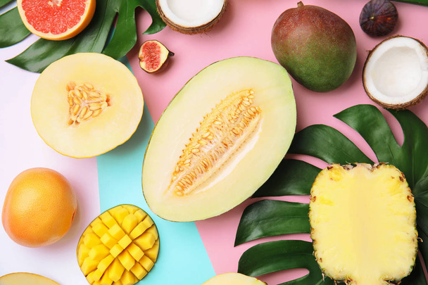 Flat lay composition with melon and other fruits on color background - Photo, Image
