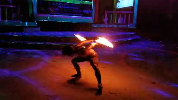 Fire dance performance made by young skilled Cambodian boy. Secret bar in the middle of the jungle Jungle Republic. 6 February 2018 Koh Rong Samloem Island, Cambodia.  - Πλάνα, βίντεο