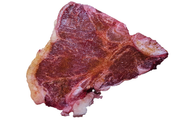 白い背景に大理石骨ステーキのクローズ アップ ビュー - 写真・画像
