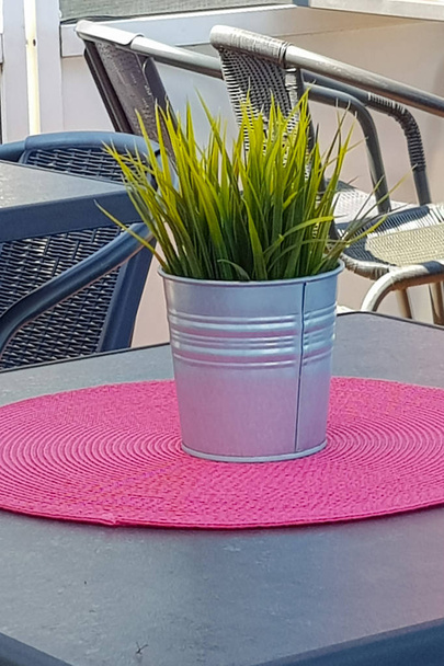 Flowerpot on a table in a coffee shop - Photo, Image