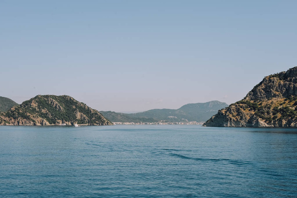 MARMARIS, TURKEY - CIRCA JUNE 2018: view of Mediterranean sea and little islands and hills from the coast of Marmaris Turkish Riviera. - Φωτογραφία, εικόνα