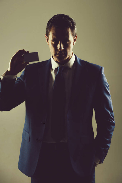 man holding bank or business card - Φωτογραφία, εικόνα
