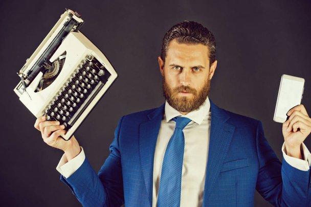 business man in blue suit and tie with typewriter, card - Fotó, kép
