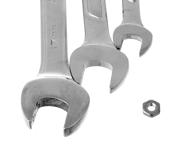 Chrome nut and wrenches. Wrong size concept. - Photo, Image