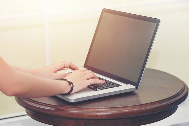 Woman working at home office hand on laptop keyboard close up - Φωτογραφία, εικόνα