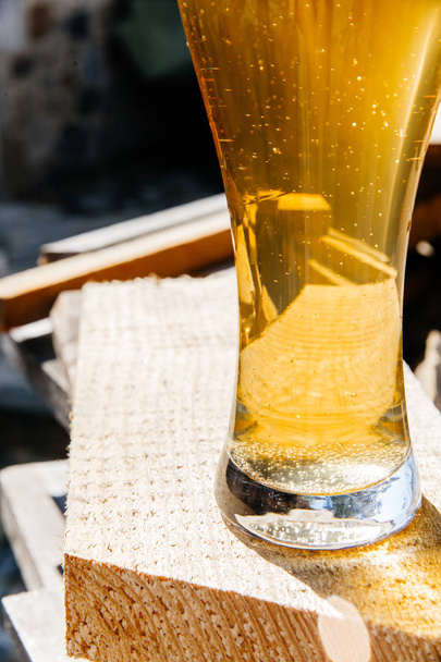 Glass of a tasty home made beer on table - Photo, image