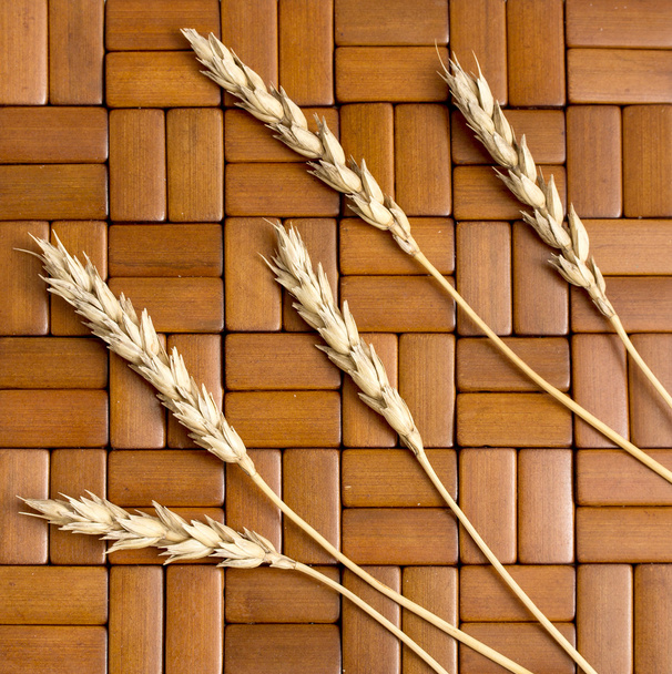 wheat ears on the wooden background - Photo, Image