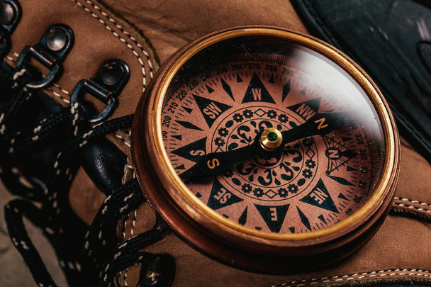 old-fashioned compass on rustic wooden table - Photo, Image