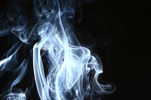 amazing swirl contrast bright smoke on black background. - Photo, Image