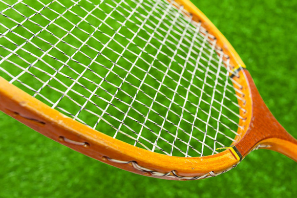 Wooden badminton racket on green grass - Φωτογραφία, εικόνα