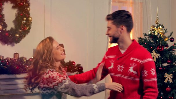 happy young woman making surprise for boyfriend on christmas - Felvétel, videó