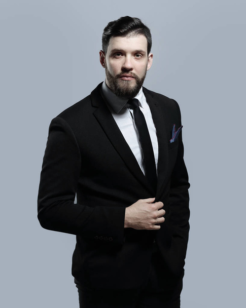 portrait of a confident businessman.isolated on grey background - Фото, зображення
