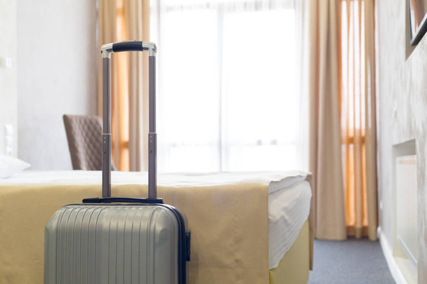 Stylish luggage bag in modern hotel room - Zdjęcie, obraz