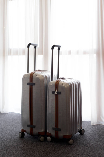 Stylish luggage bags in modern hotel room - Photo, image