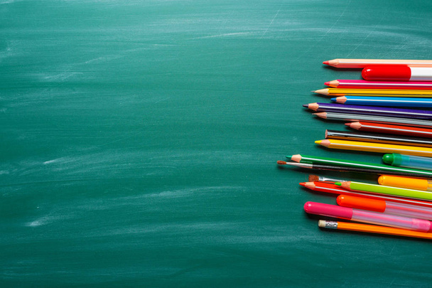 School supplies on chalkboard background - Valokuva, kuva