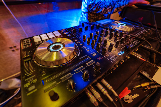 professional mixer console with vinyl discs for dj is in the party - Photo, Image