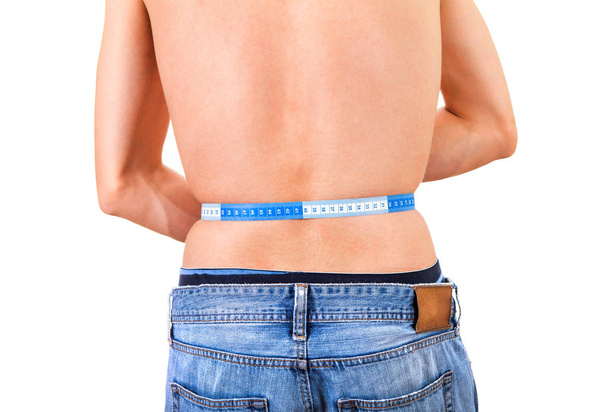 Man measure his Waist on the White Background Rear View closeup - Photo, Image