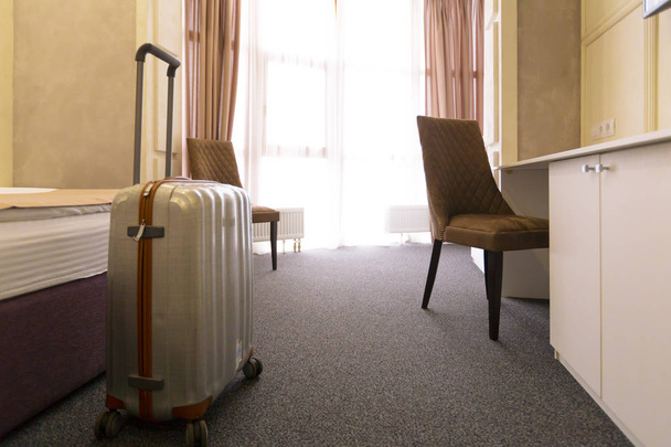 Stylish luggage bag in modern hotel room - Photo, Image