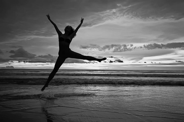meditation and yoga on the beach. Young woman doing yoga  on the sea shore - Fotó, kép