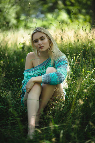 Beautiful blond girl in forest. - Zdjęcie, obraz