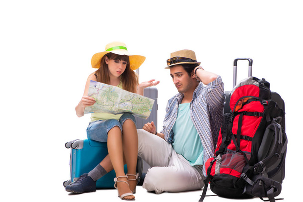 Familia joven preparándose para viajar de vacaciones en blanco - Foto, Imagen