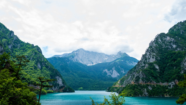 beautiful Piva Lake, mountains and cloudy sky in Montenegro - Fotoğraf, Görsel