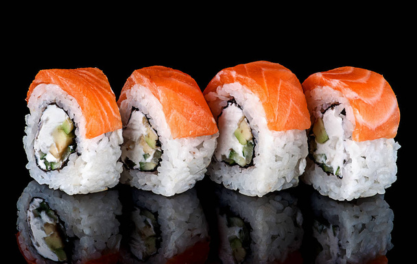 Sushi roll Philadelphia in row rotated - Foto, afbeelding