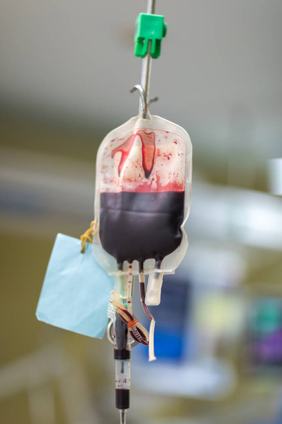 Blood bag with blood almost running out to patient. - Photo, Image