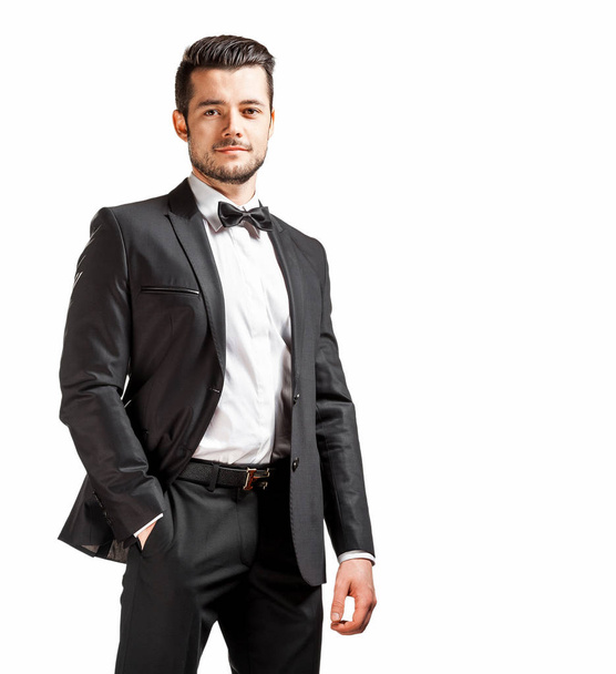 portrait of confident handsome man in black suit with bowtie - Фото, зображення