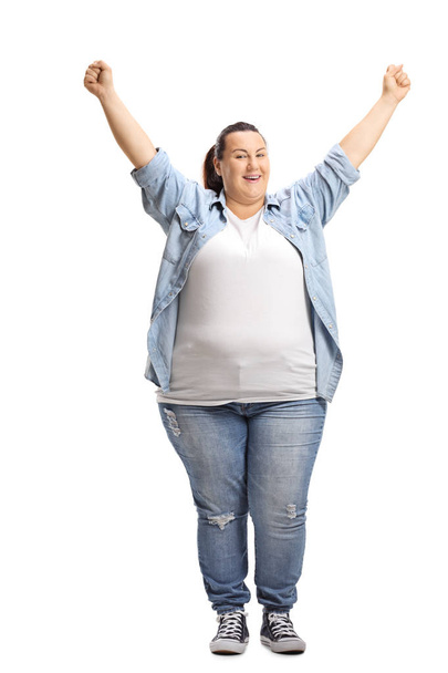Full length portrait of an overjoyed woman holding her hands up isolated on white background - Foto, Bild