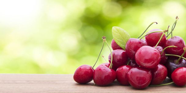 ripe cherries on a natural background - Photo, Image