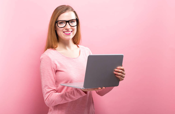 Young woman using her laptop - Foto, Bild