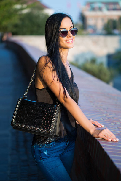 Portrait of brunette fashion beauty outdoors. - Fotó, kép