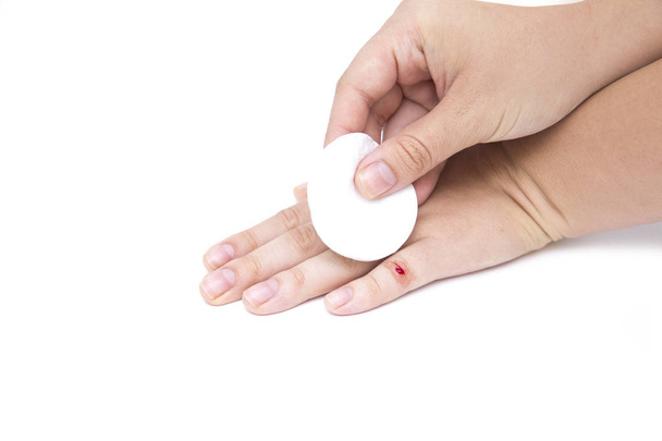 females hand with wound on finger on white background - Foto, Bild