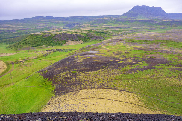 Dramatic panoramic views of the lava valley from Grabrok volcano in Iceland - Photo, image