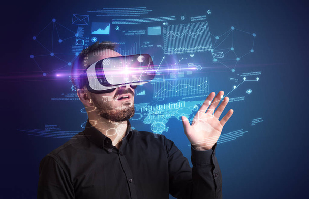 Businessman with virtual reality goggles  - Foto, imagen