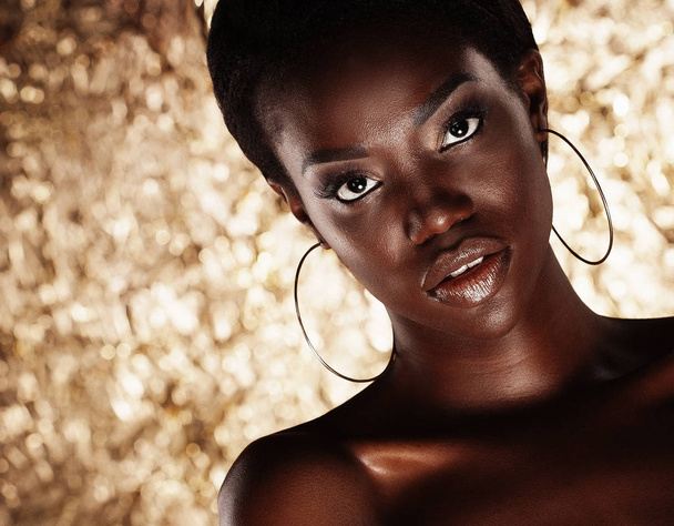 Stunning Portrait of an African American Black Woman over golden background - Foto, Imagem