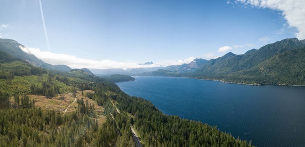 Aerial panoramic view of Nimpkish Lake during a vibrant cloudy summer day. Taken in Northern Vancouver, BC, Canada. - Φωτογραφία, εικόνα