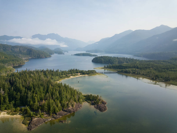 Aerial panoramic landscape view of Kennedy Lake during a cloudy summer day. Taken near Tofino and Ucluelet, Vancouver Island, BC, Canada. - Zdjęcie, obraz